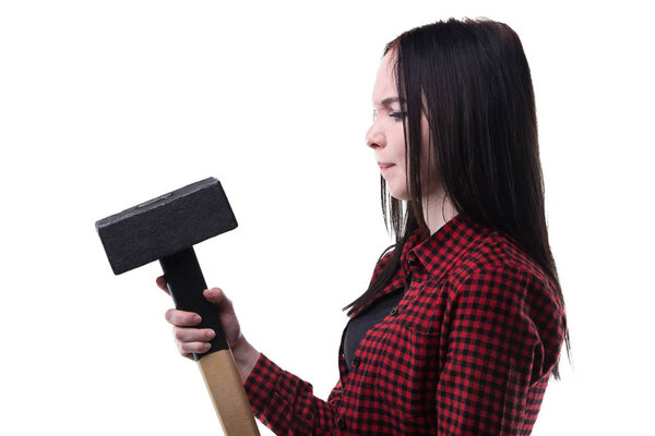 Puzzled brunette with big hammer