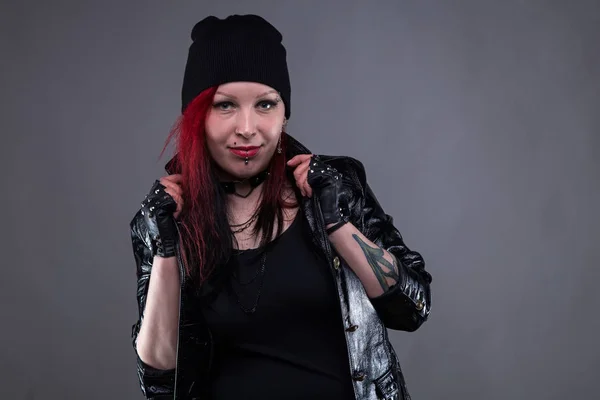 Punk woman in leather jacket with headdress