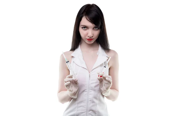 Brunette puzzled nurse with syringe — Stock Photo, Image