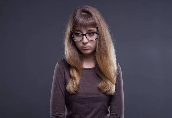 Offended teenage girl in glasses — Stock Photo, Image