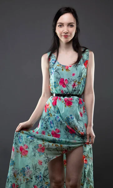 Smiling young brunette in dress — Stock Photo, Image