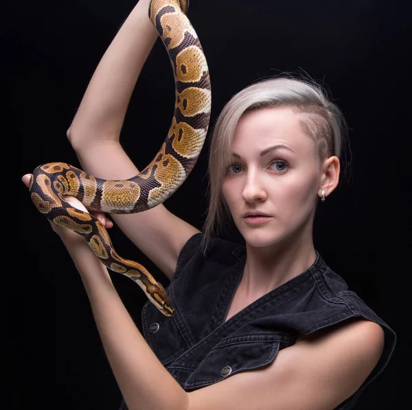 Blond young woman with snake — Stock Photo, Image