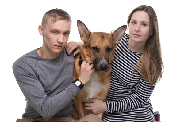 Young family and German shepherd — Stock Photo, Image