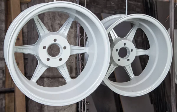 Powder coating and drying of auto disks