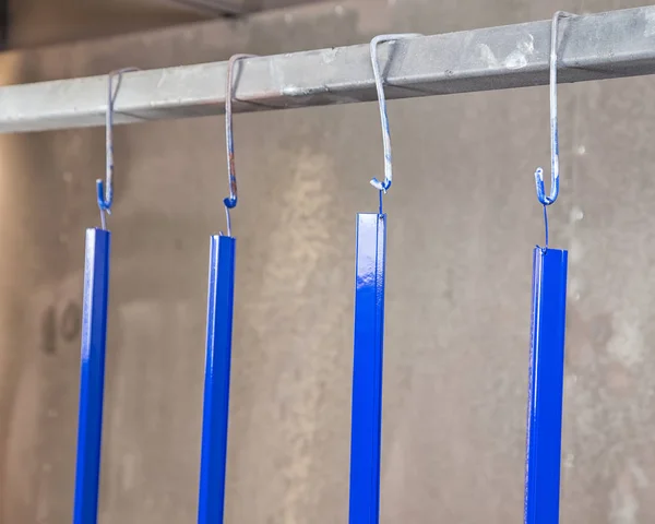 Powder coating and drying of blue metal details