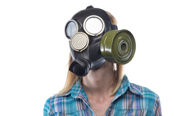 Young blond woman in gas mask