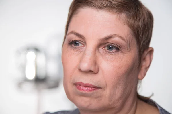 Portrait of old woman looking side, closeup — Stock Photo, Image