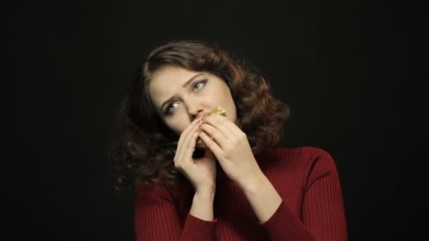 Beautiful woman eating hamburger, closeup shooting — Stock Video