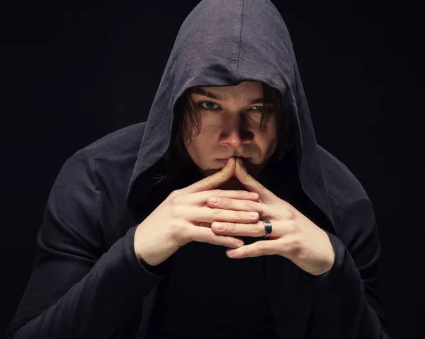 Puzzled young man in hood with hands — Stock Photo, Image