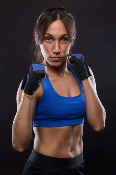 Young woman with sport gloves