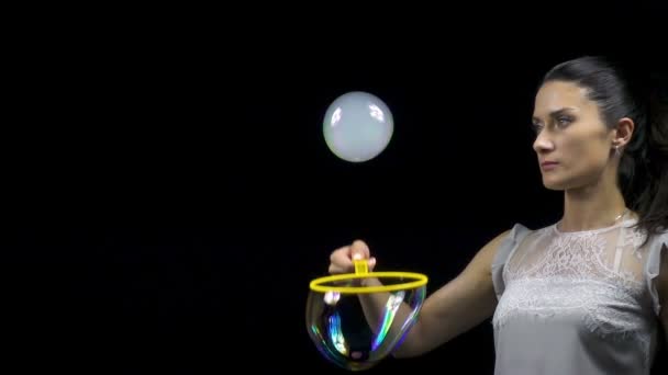 Young woman making smoky soap bubble — Stock Video