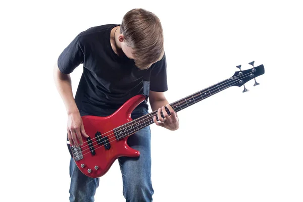 Nastoletni chłopiec gra gitara basowa — Zdjęcie stockowe