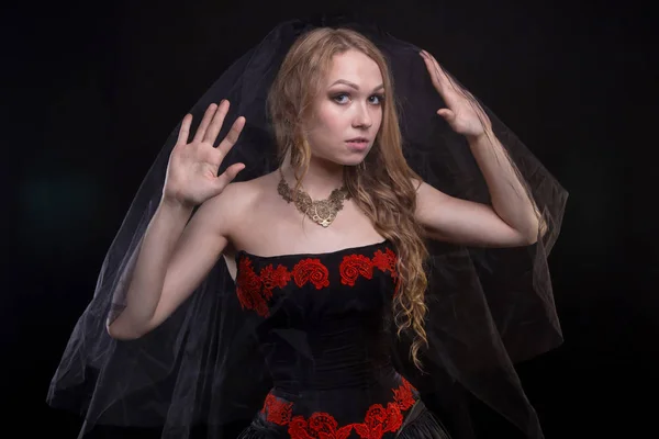 Blond woman wearing black veil — Stock Photo, Image