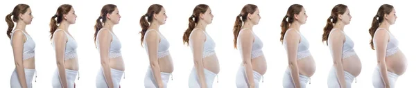 Blondine während der Schwangerschaft mit nacktem Bauch — Stockfoto