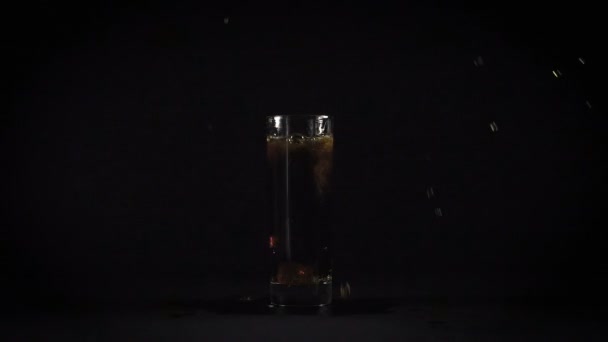 Falling fake ice in sparkling water — Stock Video