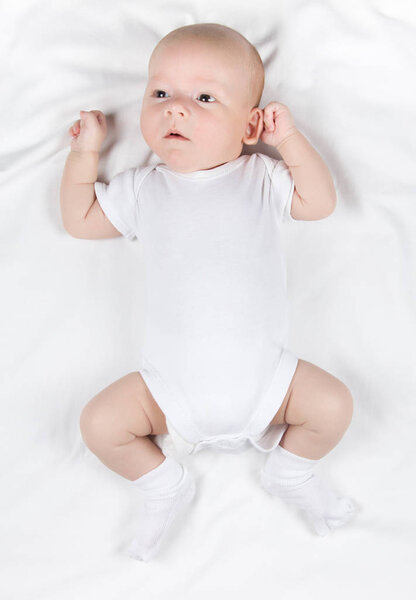 Lying two-month baby, overhead photo