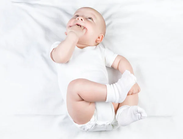 Baby with hand in mouth — Stock Photo, Image
