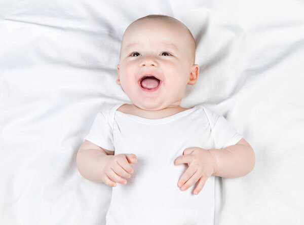 Laughing happy five-month baby