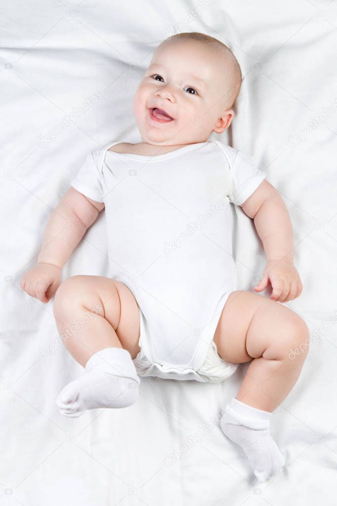Smiling baby with brown eye