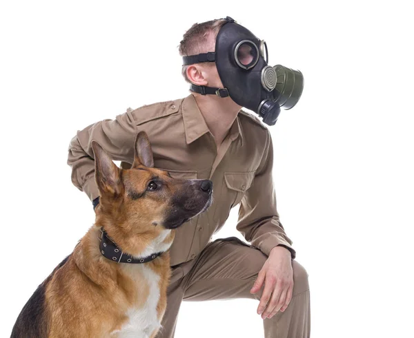 Dog handler in gas mask with shepherd dog — Stock Photo, Image