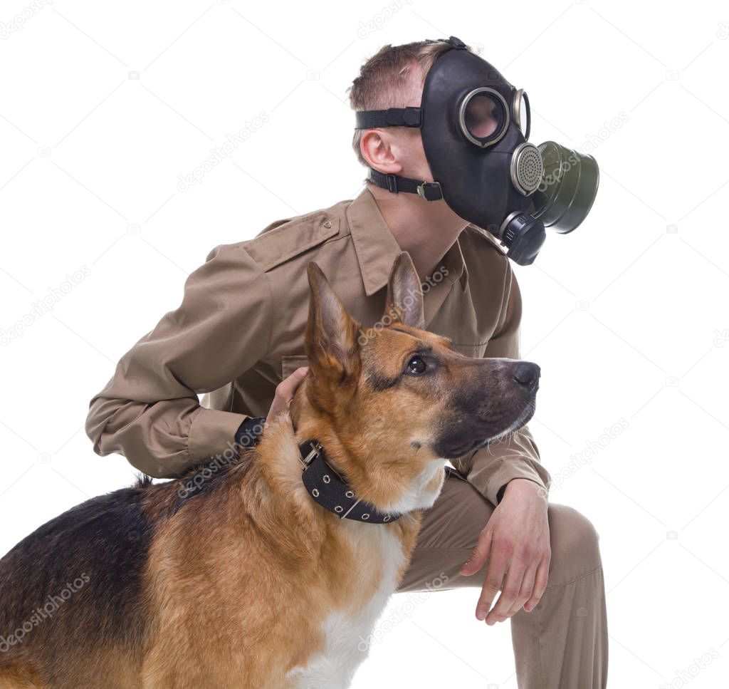 Cynologist in gas mask with dog