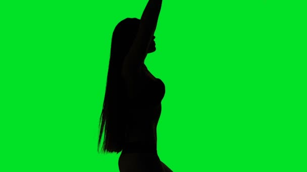 Tanzende Silhouette einer jungen Frau — Stockvideo