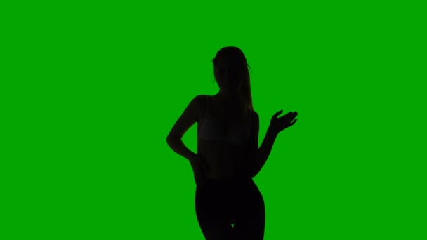 Dancing erotic young woman, silhouette — Stock Video