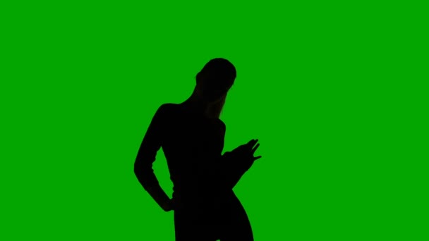 Silhouette of dancing young slim woman — Stock Video