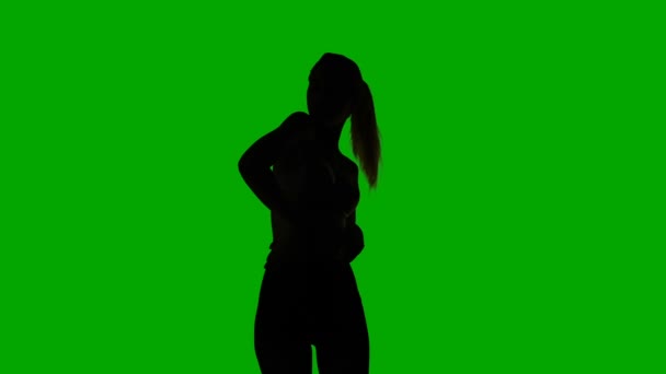 Silhouet van seksuele dansende meisje — Stockvideo