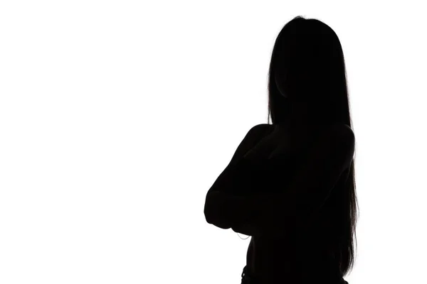 Silhouette of woman with arms crossed — Stock Photo, Image