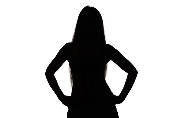 Silhouette di ragazza con le mani sui fianchi — Foto Stock