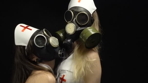 Two young sexy nurses in gas mask — Stock Video