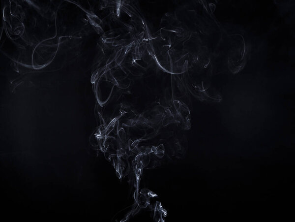 White smoky cloud of aroma stick on black background