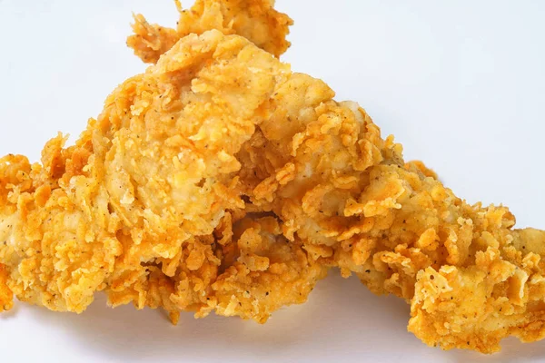 Foto de filé de frango frito amarelo no fundo branco — Fotografia de Stock