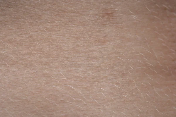 Макро фото молодої рожевої шкіри людини з невусом — стокове фото