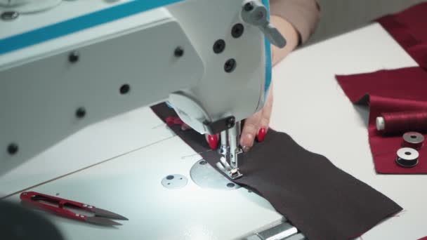 Shooting of tailor woman sewing order on electric machine — Stock Video