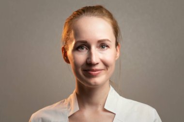 Image of the young smiling ginger woman