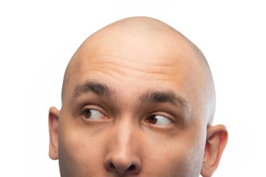 Image of young shaved mans head on white