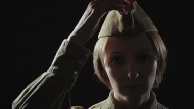 Video of woman in soviet red army uniform in shadow