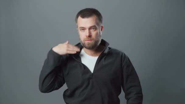 Shooting of young man with beard in hot room — Stock Video