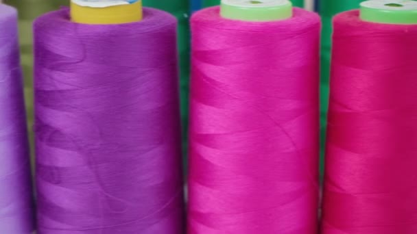 Pink spools of threads in workshop — Stock Video