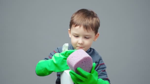 Shooting of little boy playing with household chemicals — Stock Video