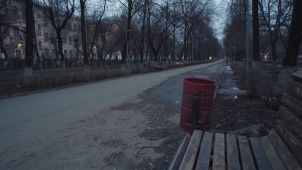 Shooting of dismal alley with bench and trash can — Stock Video