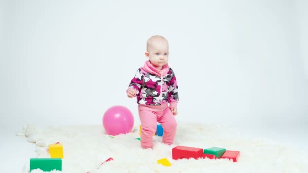 Video of one-year-old girl whirling among toys — Stock Video