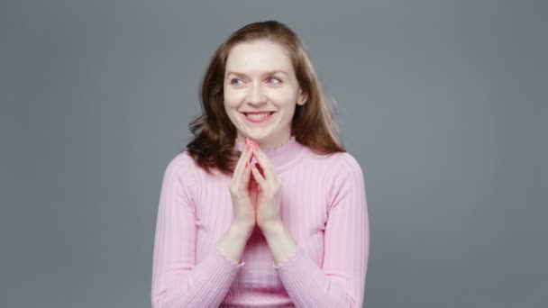 Video of plotting woman in pink turtleneck — Stock Video