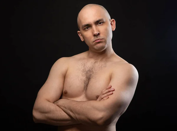 Photo of bald doubting man with bare shoulders — Stock Photo, Image
