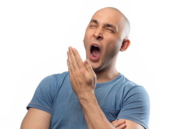 Foto de homem bocejo careca em camisa azul tee — Fotografia de Stock