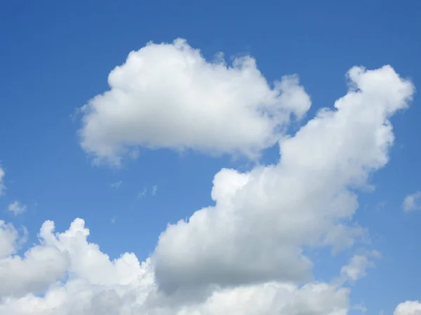 Puffy clouds on a sunny day