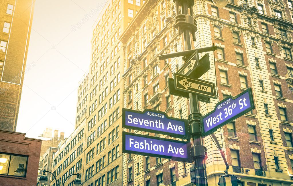 Street sign of Seventh and Fashion Ave with West 36th St at sunset in New York City - Urban concept and road direction in Manhattan - American world famous capital destination on warm vintage filter
