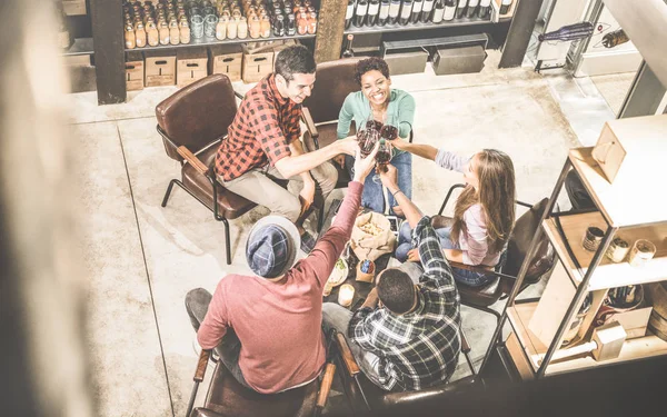 Top view of multi racial friends tasting red wine and having fun at fashion bar winery - Multicultural friendship concept with people enjoying time out drinking together - Urban retro contrast filter — Stock Photo, Image